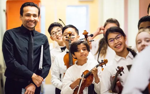 a group of people holding musical instruments