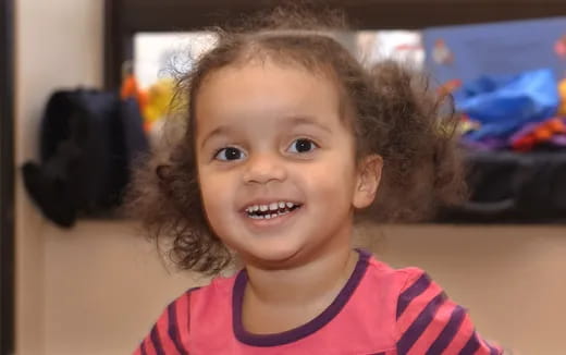 a close-up of a girl smiling