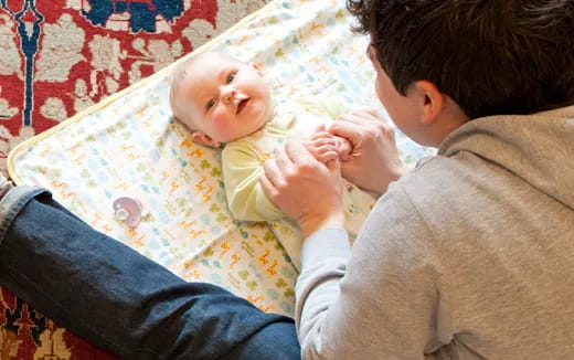 a man holding a baby