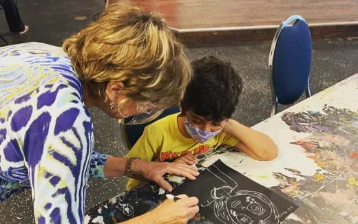 a man and a child painting