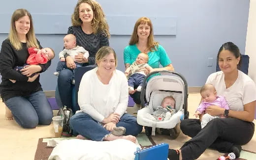 a group of women and babies