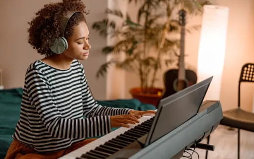 a woman playing a piano