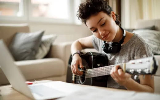 a person playing a guitar