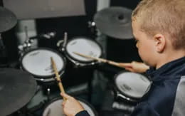 a boy playing drums