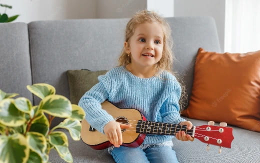 a girl playing a guitar