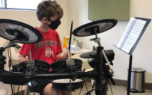 a boy playing the drums