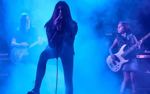 a person singing on stage