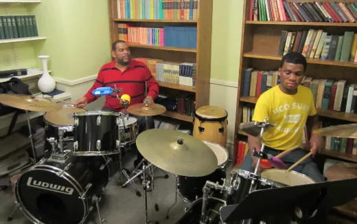 a couple of men playing drums