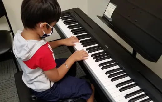 a child playing a piano