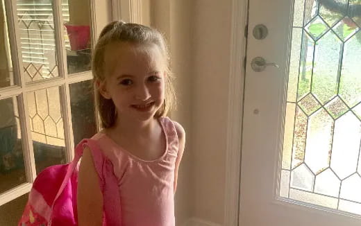 a girl with a pink shirt