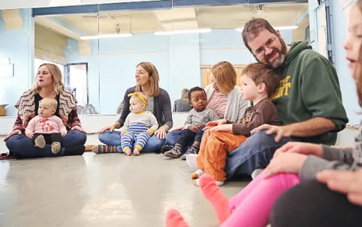 a group of people sitting on the floor
