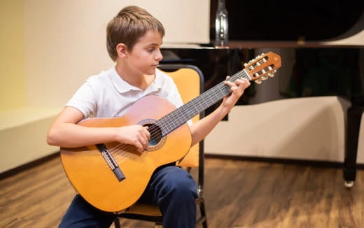 a person playing a guitar