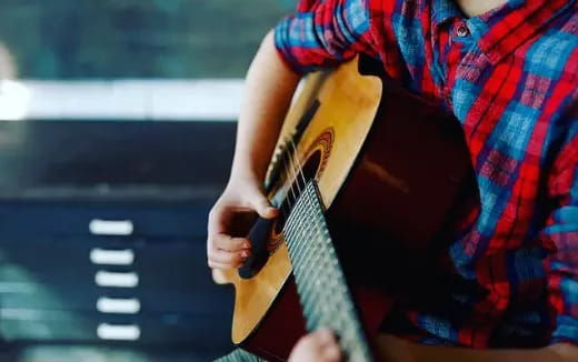 a person holding a guitar