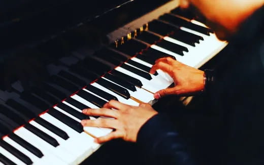 a person playing a piano