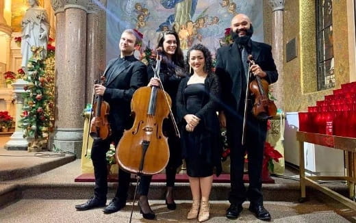 a group of people holding musical instruments