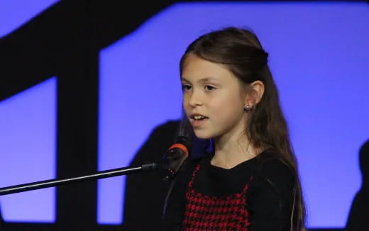 a person speaking into a microphone