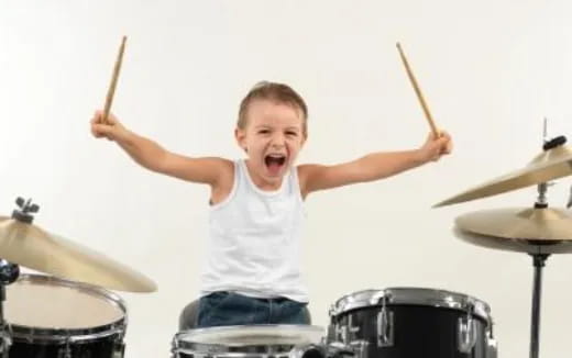 a boy playing drums