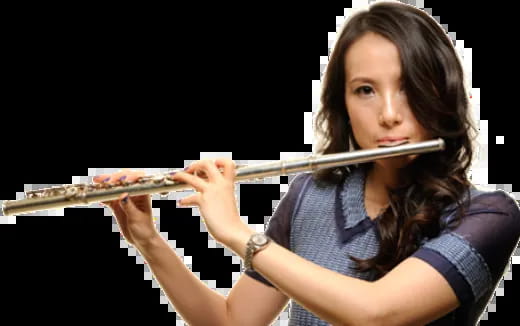 a woman playing a flute