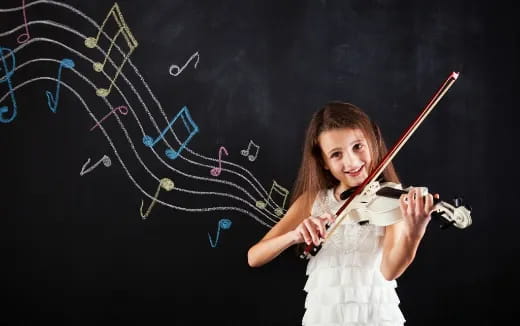 a girl holding a violin