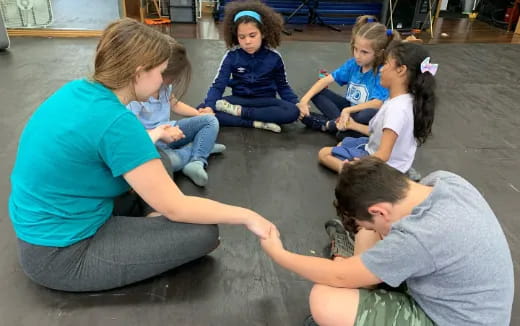 a group of children sitting on the floor