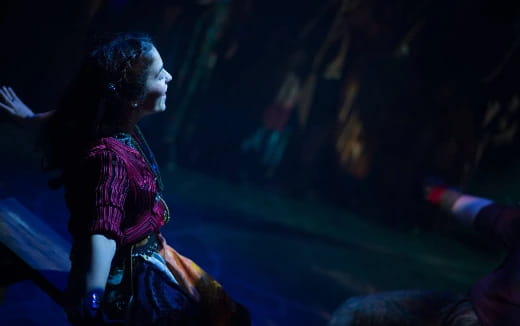 a person singing on stage