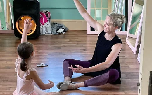 a woman and a girl exercising
