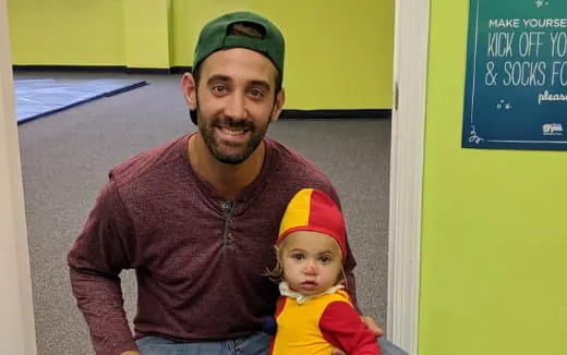 a man and a child posing for the camera