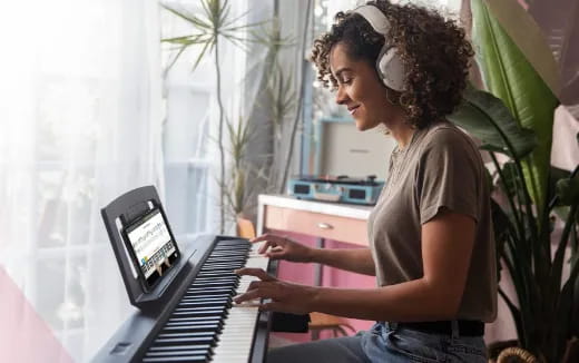 a woman playing a piano