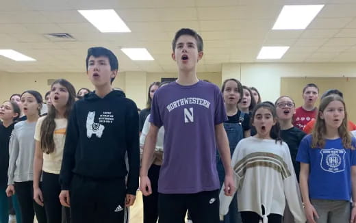 a group of people standing in a room