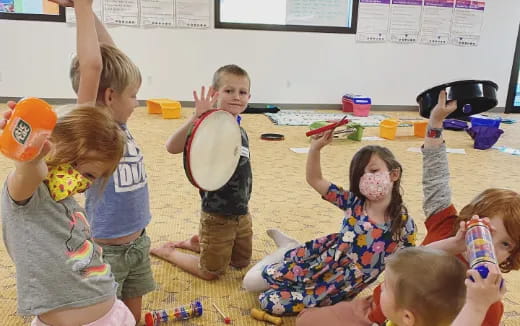 a group of children playing with toys