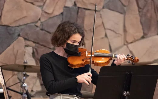 a person playing a violin