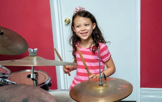 a girl playing drums