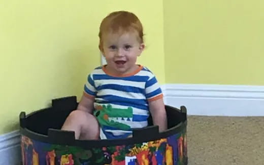a child sitting in a basket