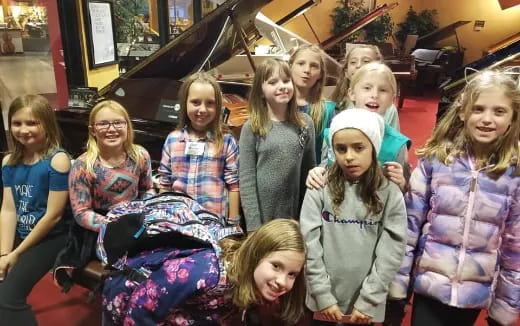 a group of girls posing for a photo