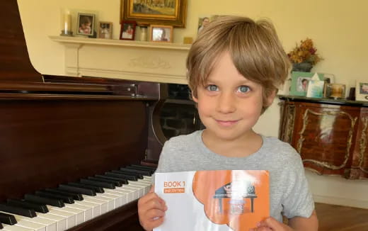 a child holding a book