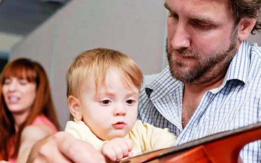 a man holding a baby