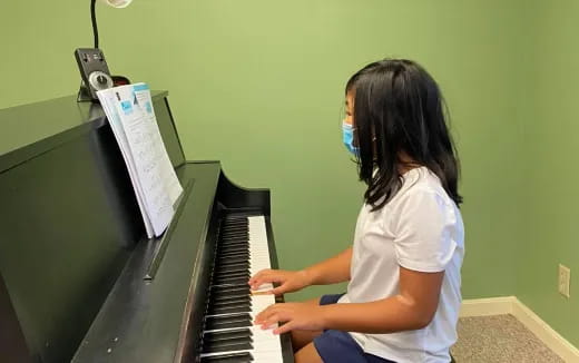 a person playing a piano