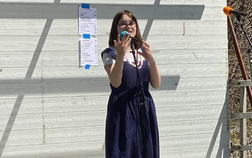 a woman holding a microphone