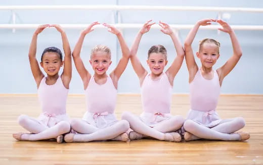 a group of children in white clothes
