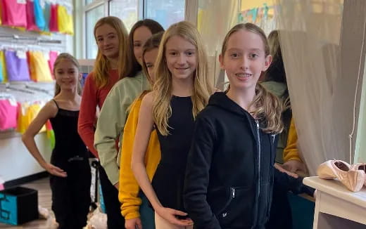 a group of girls posing for a picture