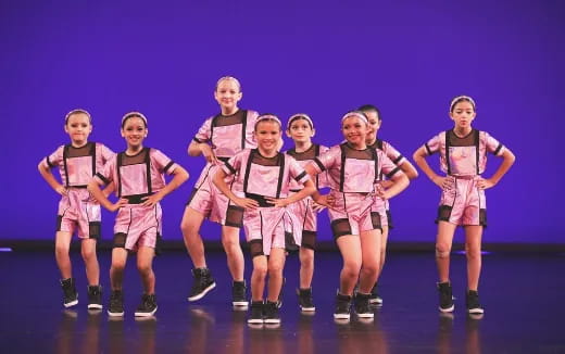 a group of people wearing matching outfits