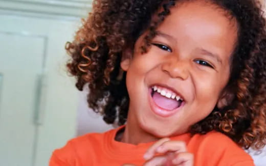 a close-up of a child smiling