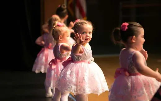 a group of girls in dresses