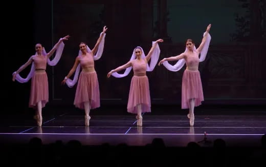 a group of women dancing on a stage