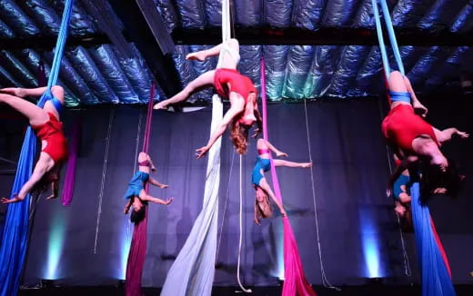 a group of people performing on a stage