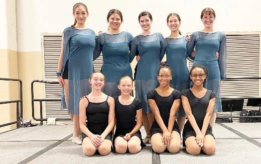 a group of women posing for a photo