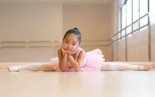 a baby lying on the floor