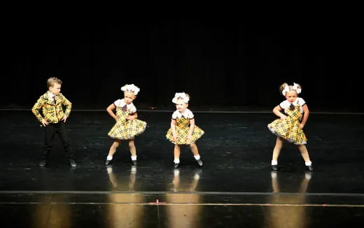 a group of children on a stage