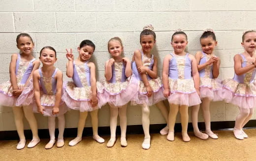 a group of girls in dresses