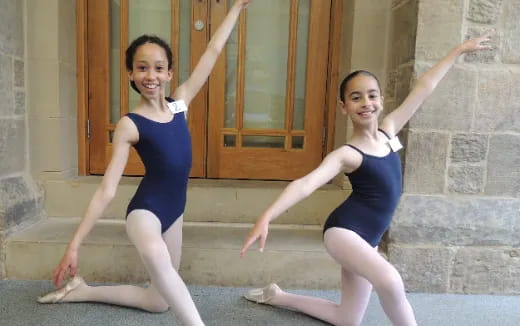 two women in leotards